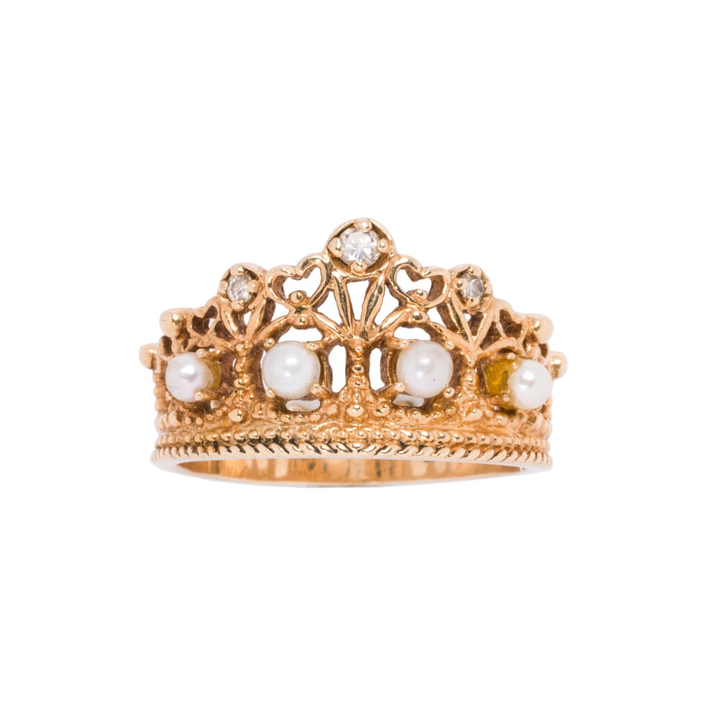 A diamond, seed pearl, and 14k gold ring: A diamond, seed pearl, and 14k gold ring Designed as an open-form crown, set with three single-cut diamonds and four seed pearls; size 7; 4.10 grams