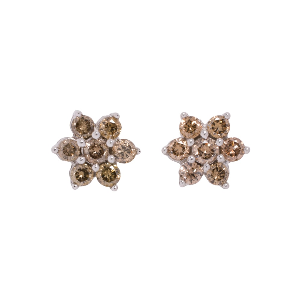 A pair of diamond and 14k white gold earrings: A pair of diamond and 14k white gold earrings Of floriform design, set with seven round brilliant-cut brown diamonds weighing a total of approximately 1.00 carat; diameter: 3/8 in; 1.50 gramsNote: