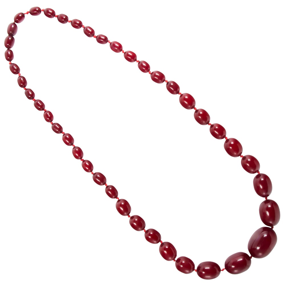 A cherry amber bakelite beaded necklace: A cherry amber bakelite beaded necklace Featuring a graduating of oval-shaped cherry amber bakelite beads ranging from 9.97 to 29.00 mm; length: 30 in; 61.15 grams
