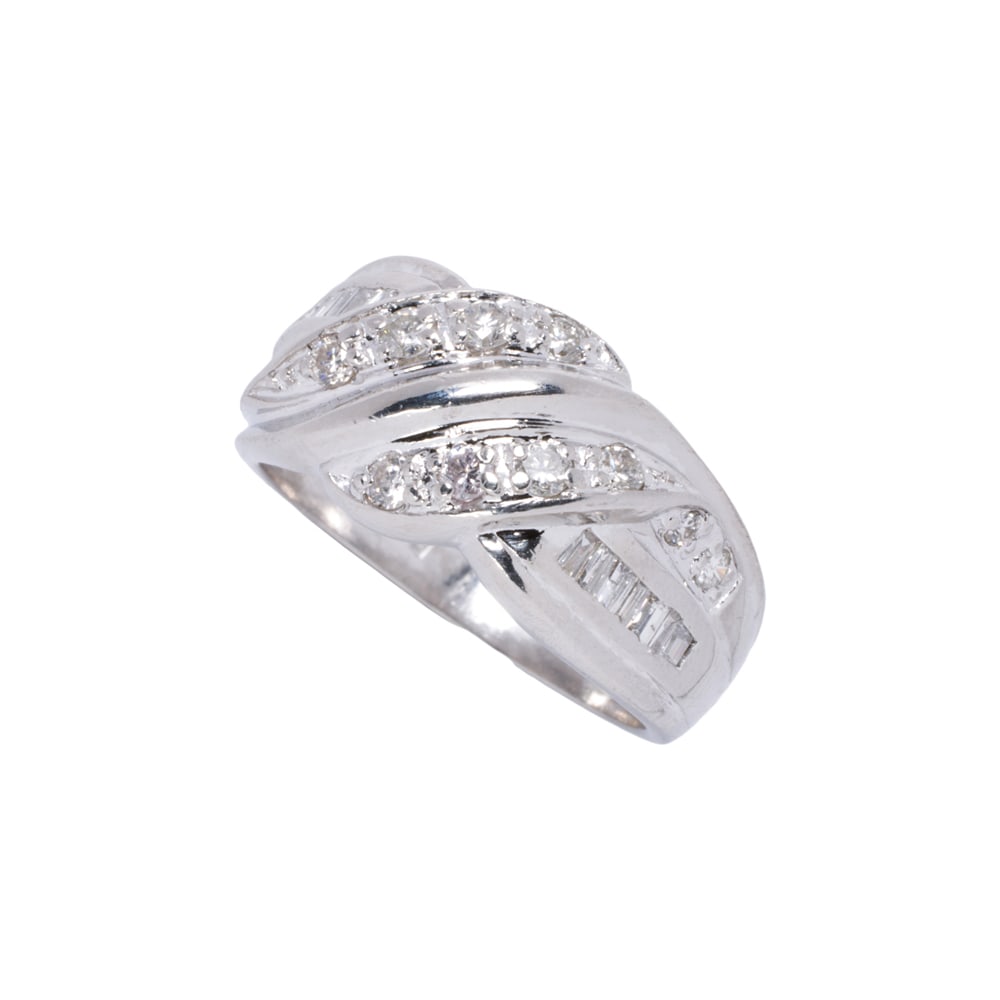 A diamond and platinum ring: A diamond and platinum ring featuring round brilliant and baguette-cut diamonds weighing approximately 0.50 carats; size: 6 1/4; 7.70 grams