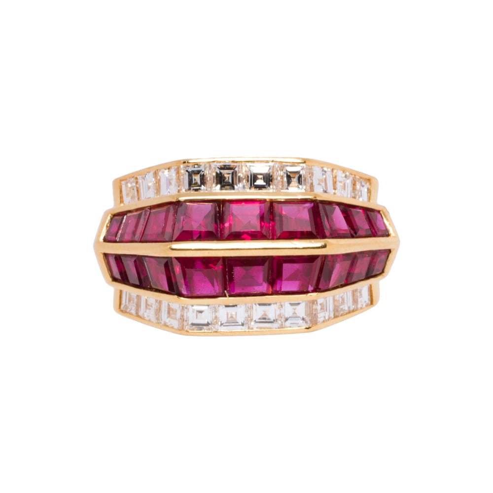 A ruby, diamond and 18k gold ring: A ruby, diamond and 18k gold ring featuring a line of square-cut rubies, flanked by princess-cut diamonds; estimated ruby weight 2.00 carats; estimated diamond weight 1.00 carat; size: 6 1/2; 9.20 gra