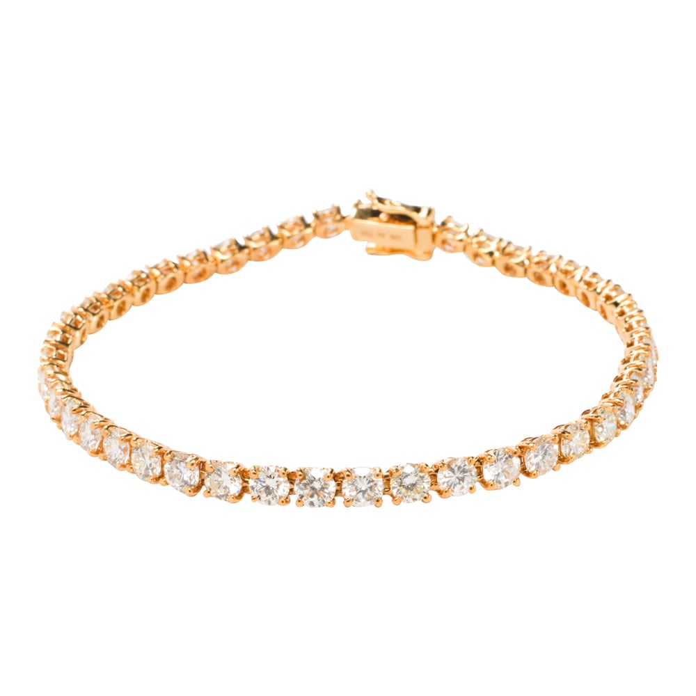 A diamond and 18k gold tennis bracelet (1 of 2)