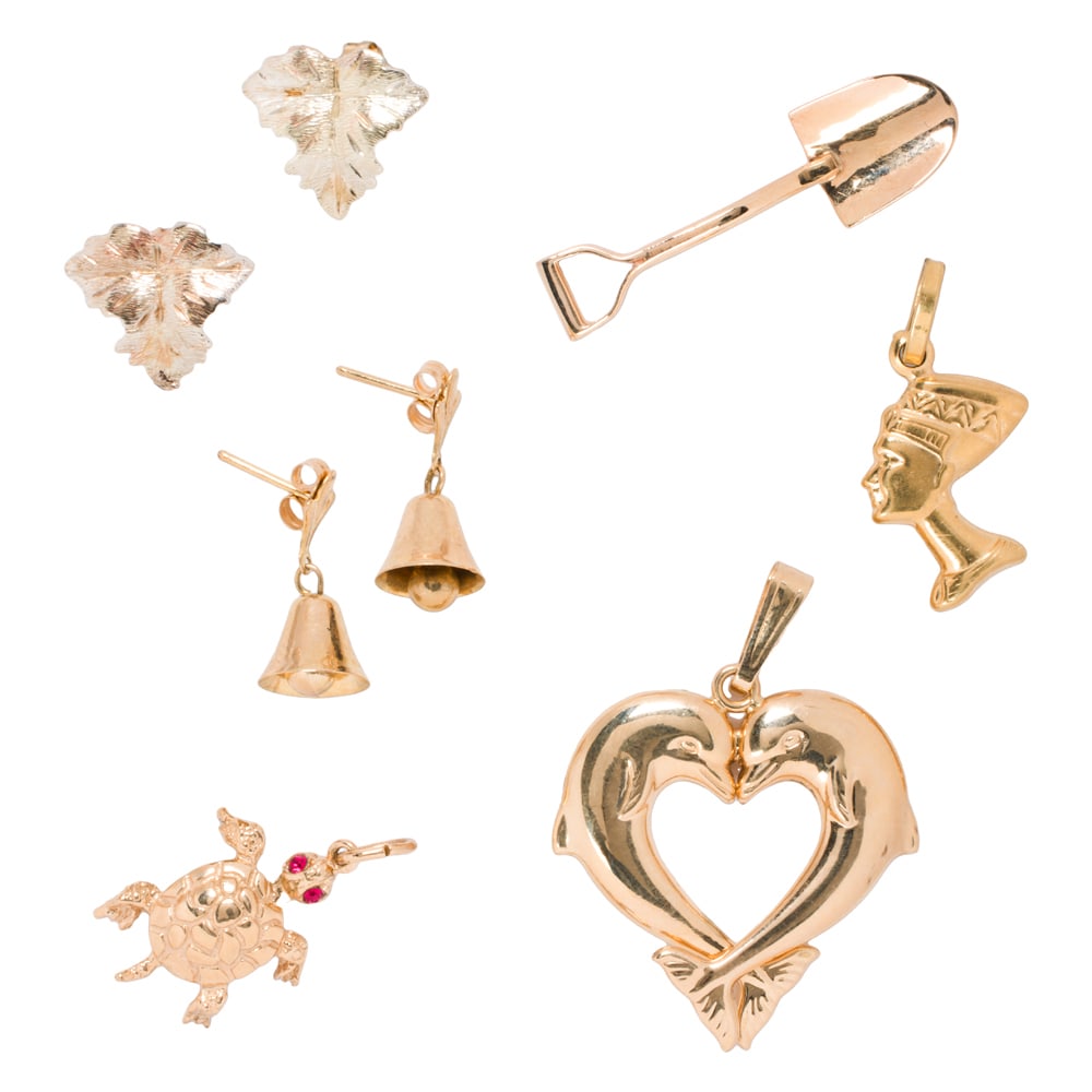 A group of 14k gold jewelry: A group of 14k gold jewelry comprising three pendants and two pairs of earrings; pendant lengths: 3/4 - 1 1/2 in; earrings lengths: all 1/2 in; 10.00 grams