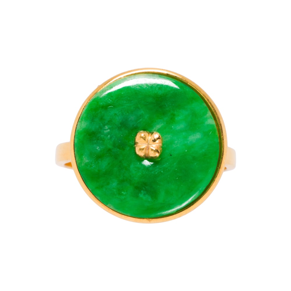 A jade and 14k gold ring: A jade and 14k gold ring Featuring a jade bi disc measuring 15.49 mm across; size 9 1/4; 4.30 grams