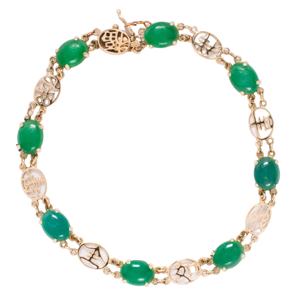 A chrysoprase and 14k gold bracelet: A chrysoprase and 14k gold bracelet Featuring eight oval shaped chrysoprase cabochons measuring 7.51 x 6.12 x 2.85 mm, interspersed by 14k gold characters; length: 7 1/2 in; 5.80 grams Condition