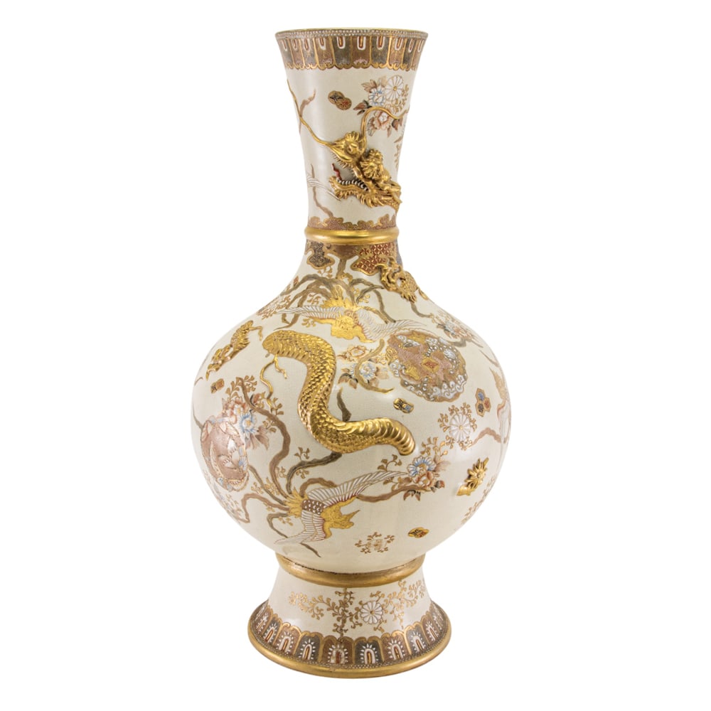 A large Japanese Satsuma vase by Kinkozan: A large Japanese Satsuma vase by Kinkozan. The bulbous body and trumpet neck featuring a raised dragon amongst various floral roundels, marked on the recessed base, Meiji period, 21.5" high.