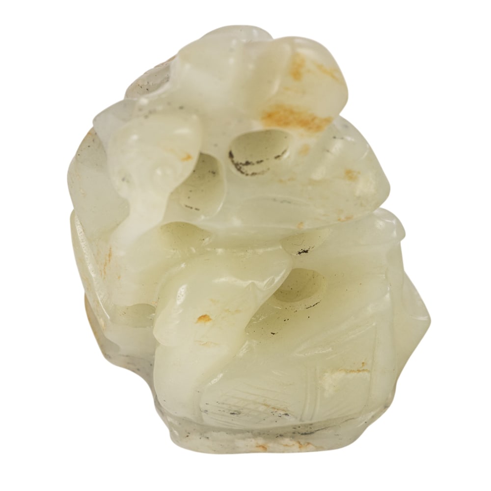 A Chinese russet and white jade carving (1 of 3)