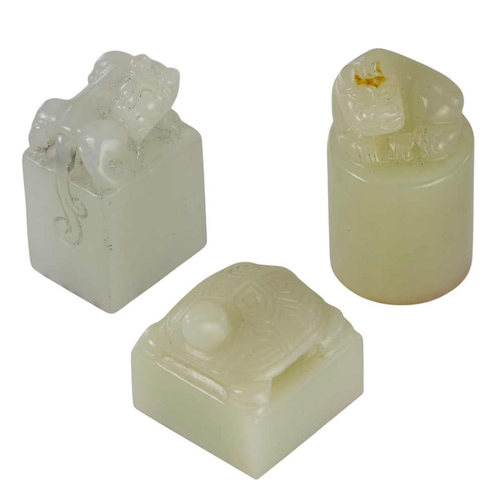 (lot of 3) Chinese white jade seals: (lot of 3) Chinese white jade seals. 19th century, 0.75" across.