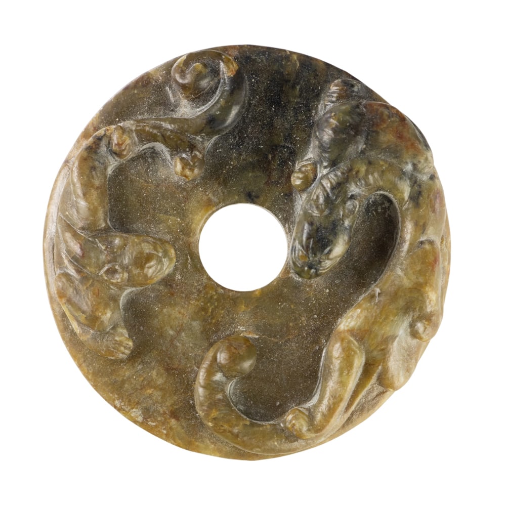 A Chinese archaic style jade bi disc: A Chinese archaic style jade bi disc. Song dynasty, 1.75" across.