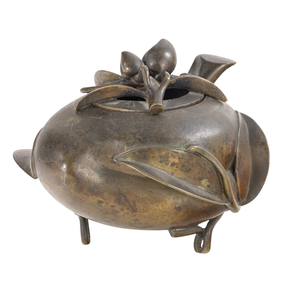 A Chinese cast bronze peach-form censer: A Chinese cast bronze peach-form censer. 18th/19th century, 4.125" high.