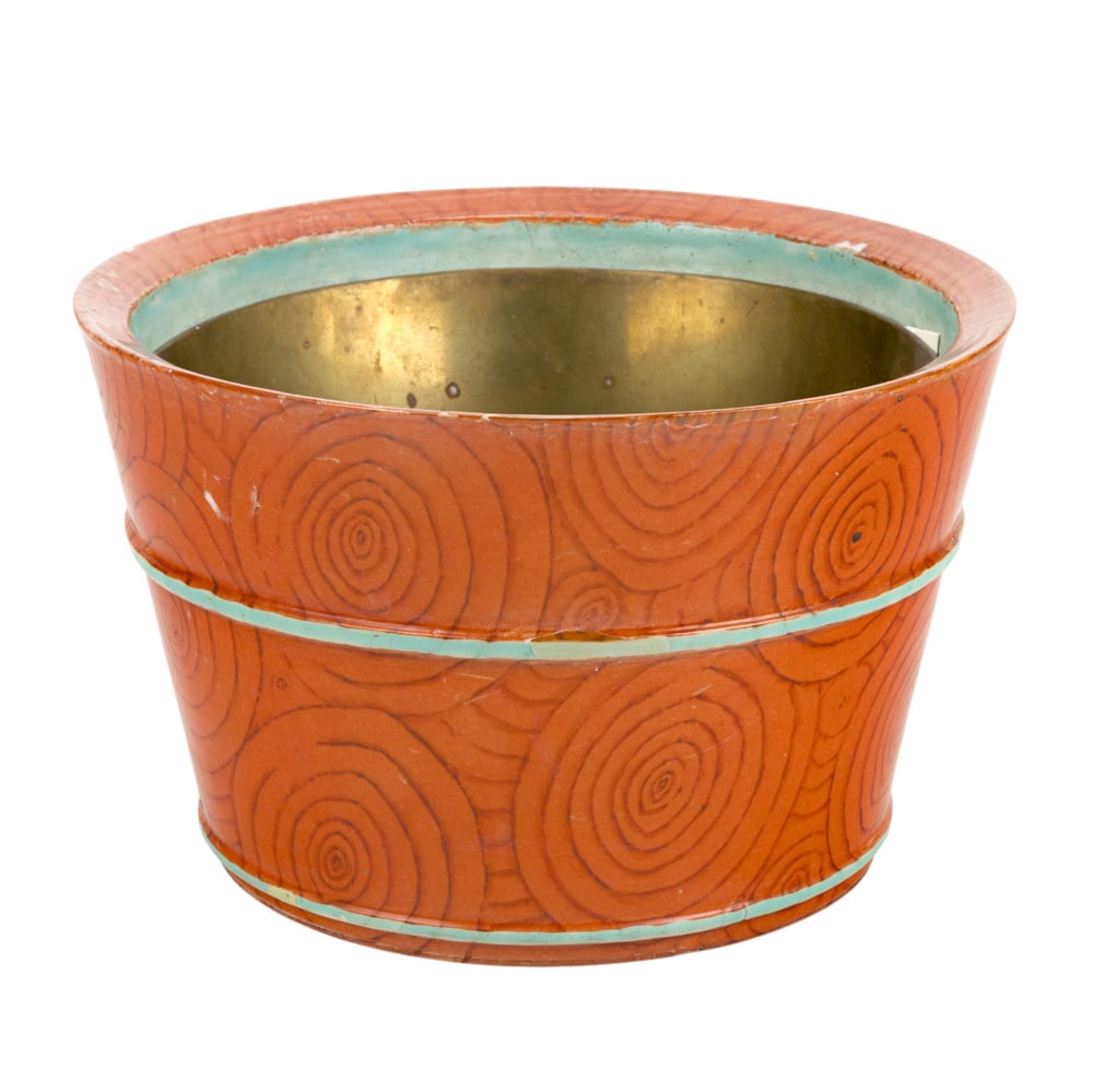 A Chinese faux boi porcelain planter: A Chinese faux boi porcelain planter. Decorated in the form of a wooden barrel, early 19th century, 10" wide. Condition: restoration to the mouth and the middle band.