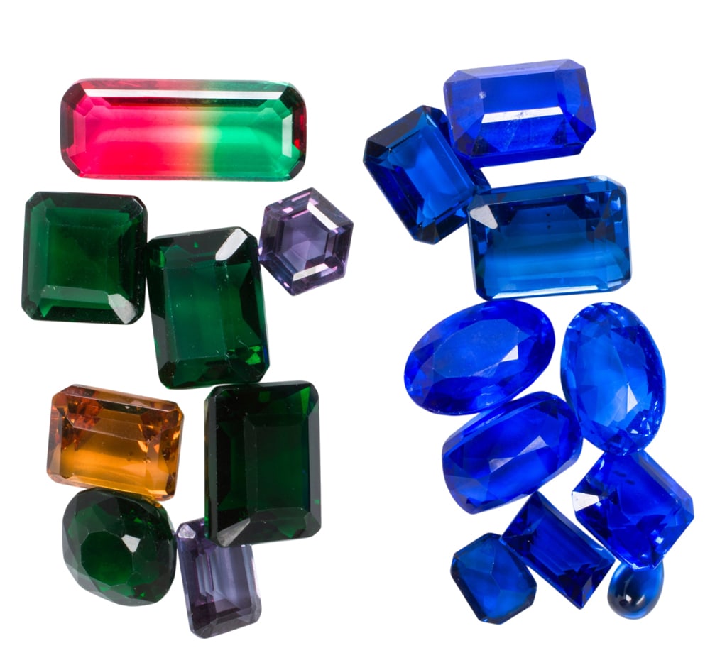 A group of unmounted imitation gemstones: A group of unmounted imitation gemstones The imitation gemstones of varying colors and cuts; SOLD AS IS