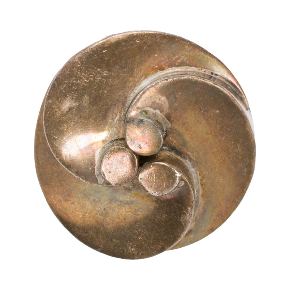 A Mexican silver brooch: A Mexican silver brooch of swirled design, marked "PR562"; length: 1 1/2 in; 36.10 grams