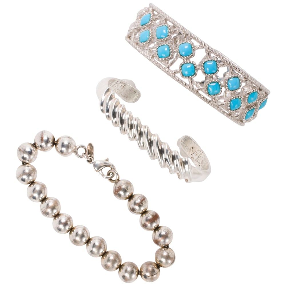 Three sterling silver bracelets: Three sterling silver bracelets Comprising two cuffs and one silver beaded bracelet including Judith Ripka; gross weight: 92.10 grams