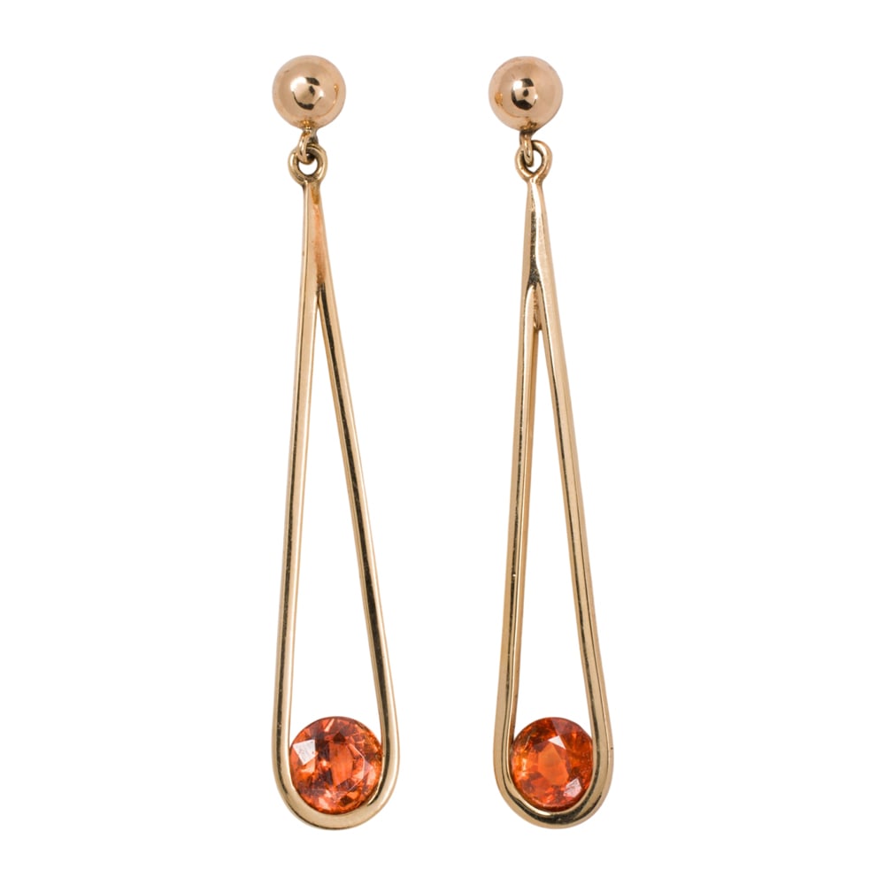 A pair of citrine and 18k gold earrings: A pair of citrine and 18k gold earrings The loop-shaped earrings suspending round-cut citrines; length: 2 in; 4.00 grams