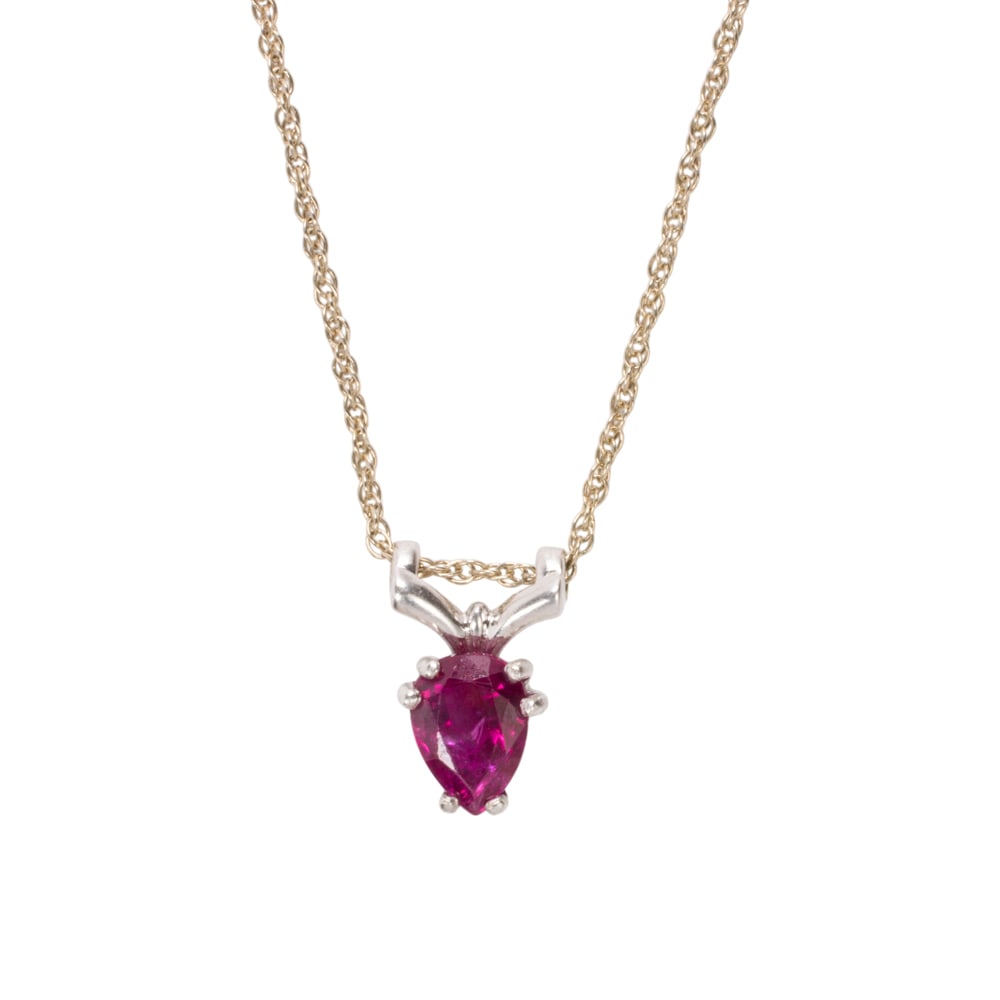 A ruby and 14k white gold necklace: A ruby and 14k white gold necklace centering an oval-cut ruby wighing approximatley: 0.65 carats; chain length: 16 in; 2.00 grams