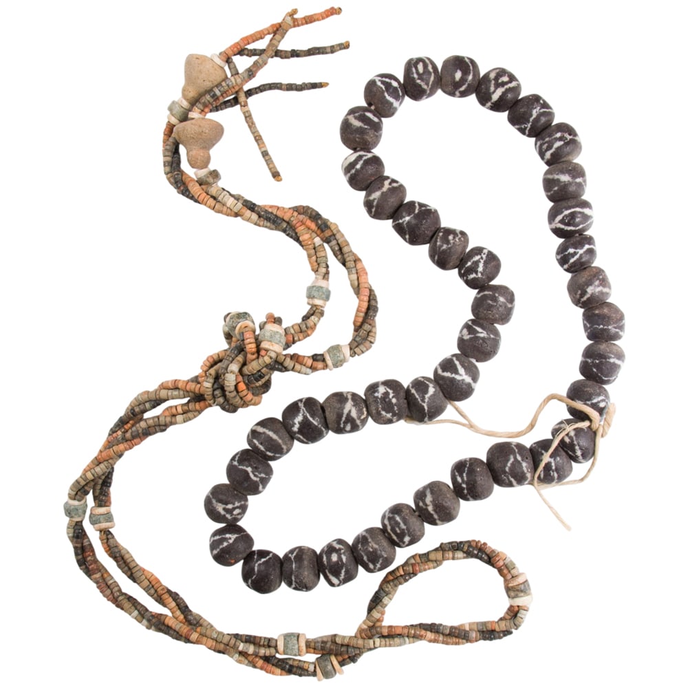 A group of stoneware beads: A group of stoneware beads The beads of varying styles and designs; SOLD AS IS