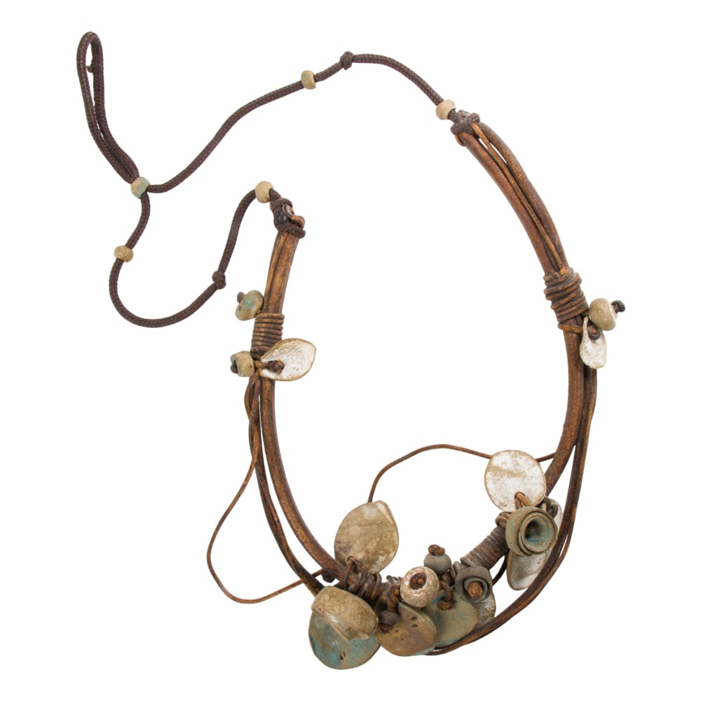 A leather and stoneware necklace: A leather and stoneware necklace Featuring handcrafted ceramic beads; SOLD AS IS