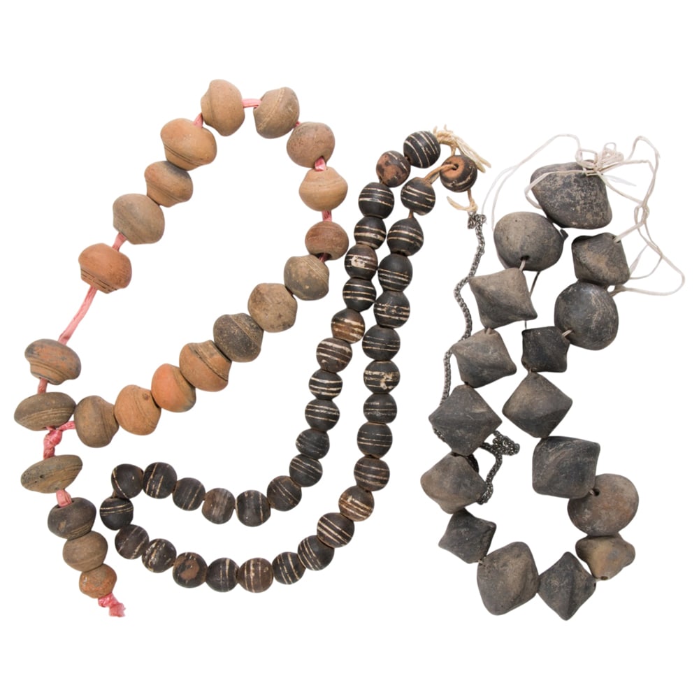 A group of stoneware beaded necklaces: A group of stoneware beaded necklaces The necklaces of varying styles and designs; SOLD AS IS