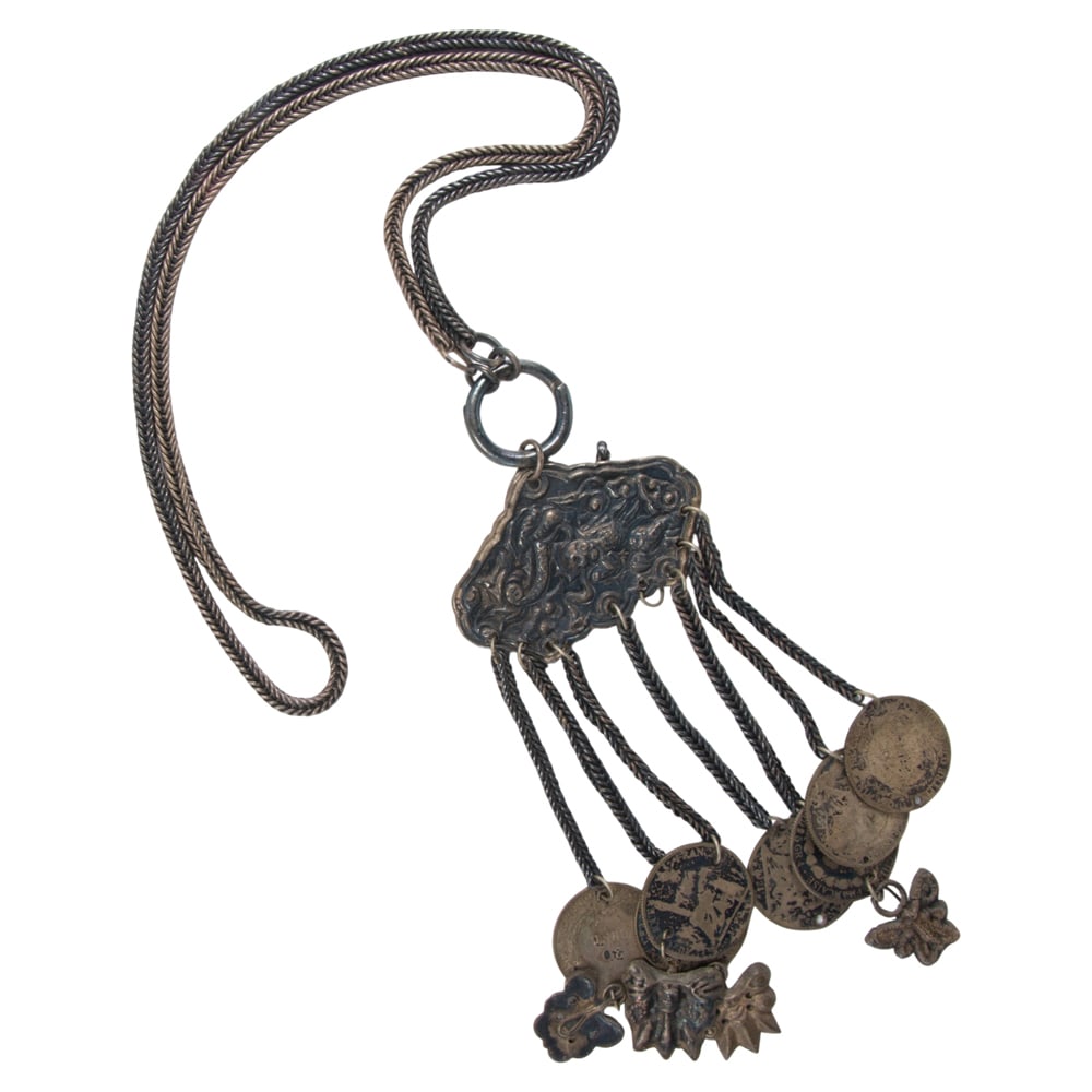 A metal coin necklace: A metal coin necklace The necklace featuring a central pendant suspended with Francs, on braided cord; SOLD AS IS
