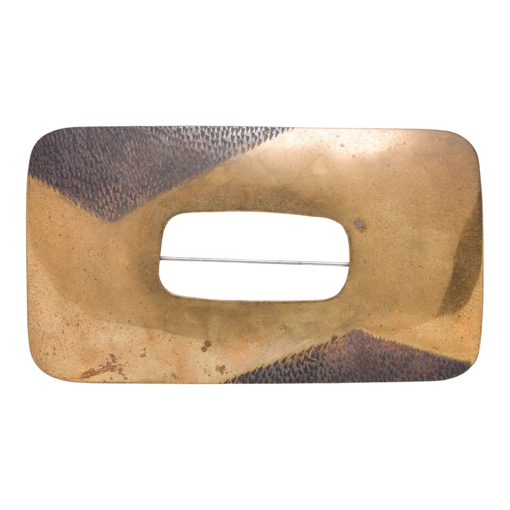 A large brass brooch
