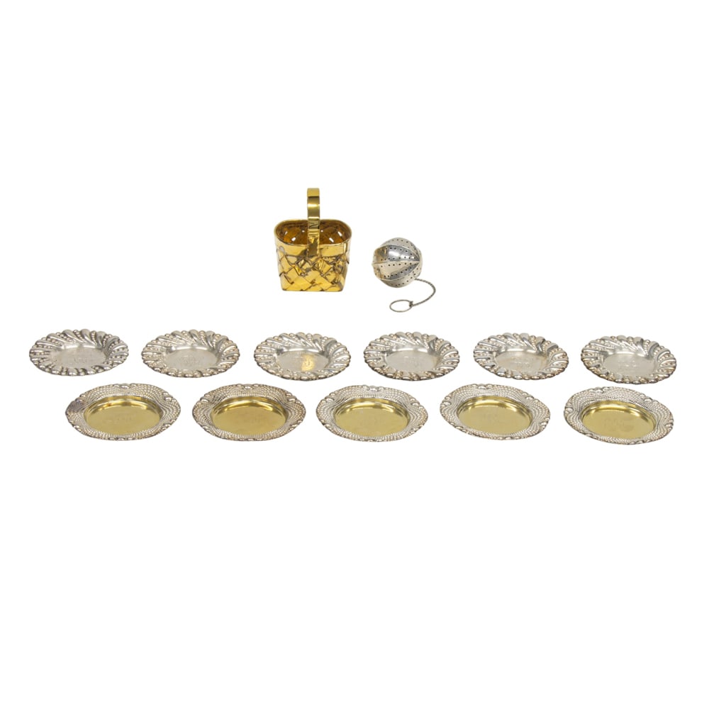 A group of small sterling table items: A group of small sterling table items, comprising: set 6 monogrammed butter pats, Wallace, D. 2 7/8 in; set 5 monogrammed butter pats, Gorham, D. 3 1/8 in; a tea ball with chain; and a hand made gilt 