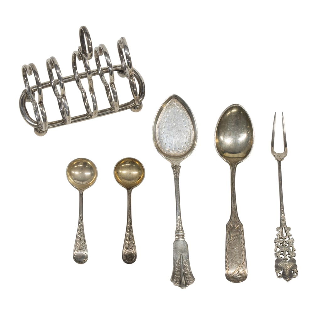 A group of small English silver items: A group of small English silver items, comprising: small toast rack, Samuel Walton Smith & Co., London, 1906, L. 3 1/8 in; small spade, W.G. & S., Sheffield, 1902;, novelty lemon fork, Barnard, London