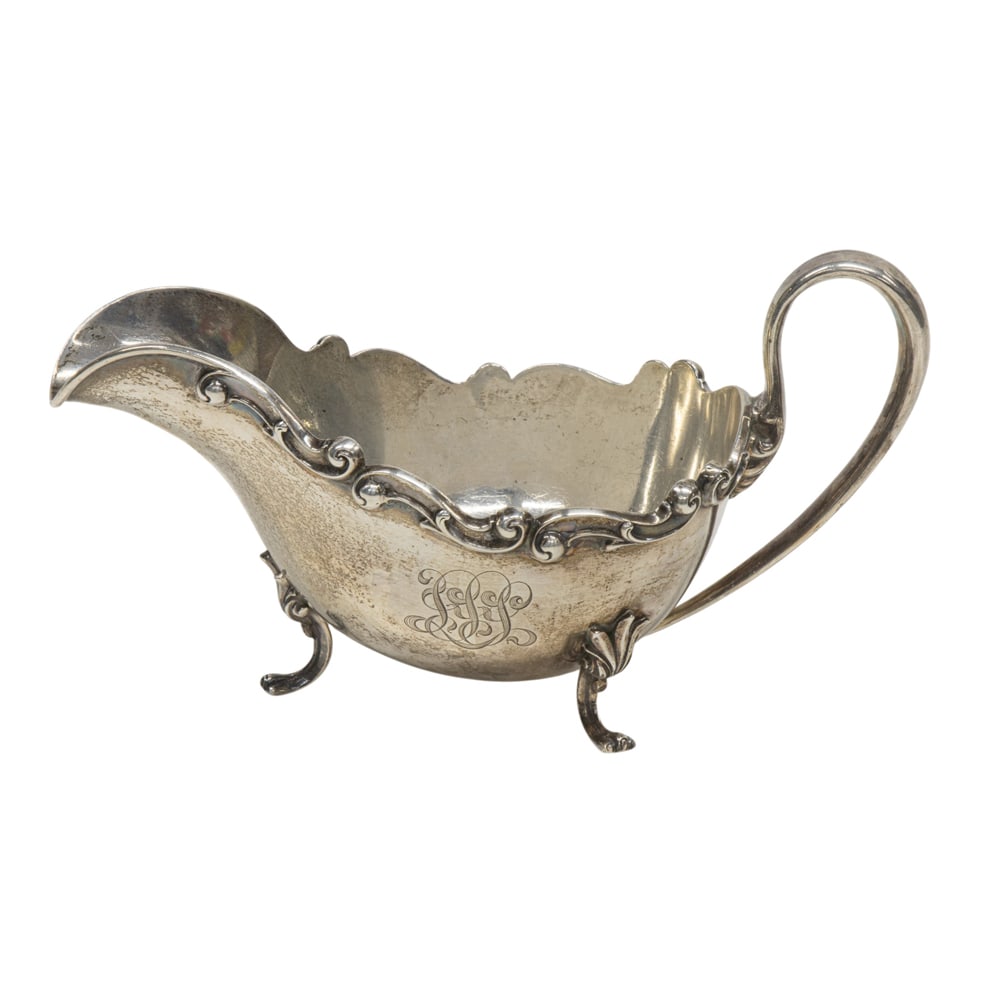 A sterling tripod sauceboat, Shreve & Co: A sterling tripod sauceboat, Shreve & Co., with monogram and date 1896, L. 7 3/4 in., (7.84 oz t.)