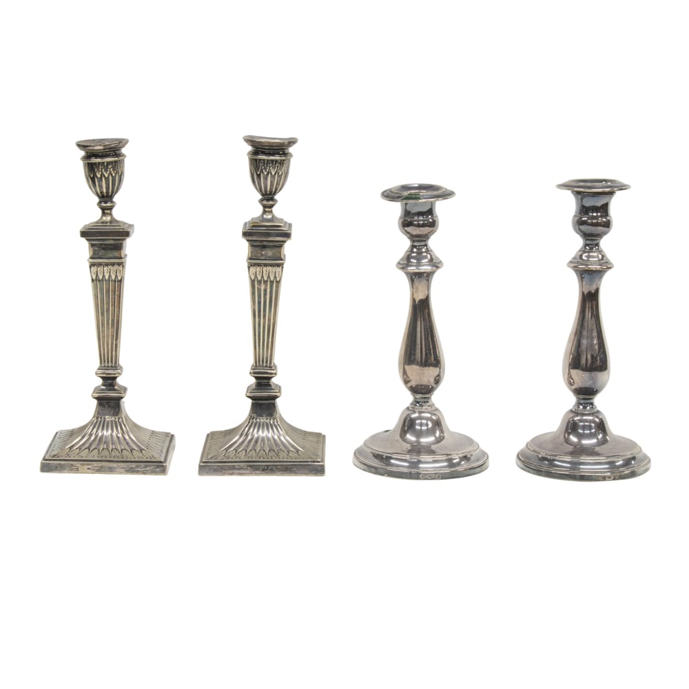 A silver plated group of two pairs of candlesticks (1 of 2)