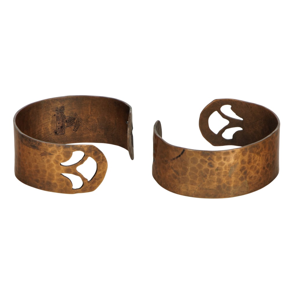 A pair of hammered copper bracelets (1 of 1)