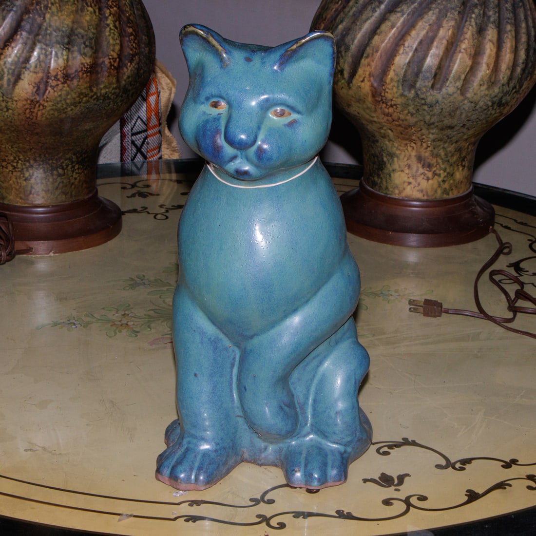 A glazed terra cotta figure of a seated cat (1 of 1)