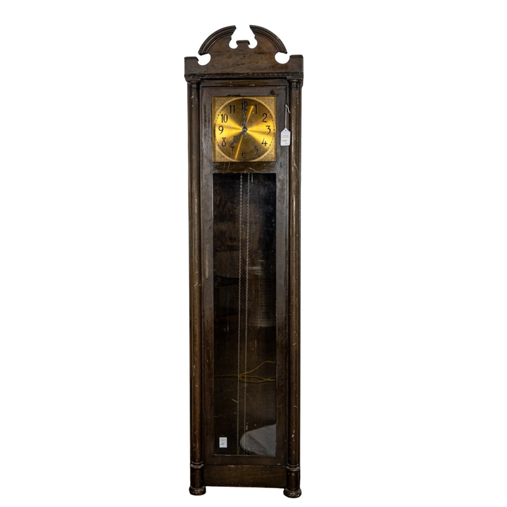 A Colonial Revival tall case clock: A Colonial Revival tall case clock, first half 20th century, the rectangular case with broken arch crest, enclosing brass tone dial with Roman numerals, marked 'I385', 81"h x 20"w x 13'd