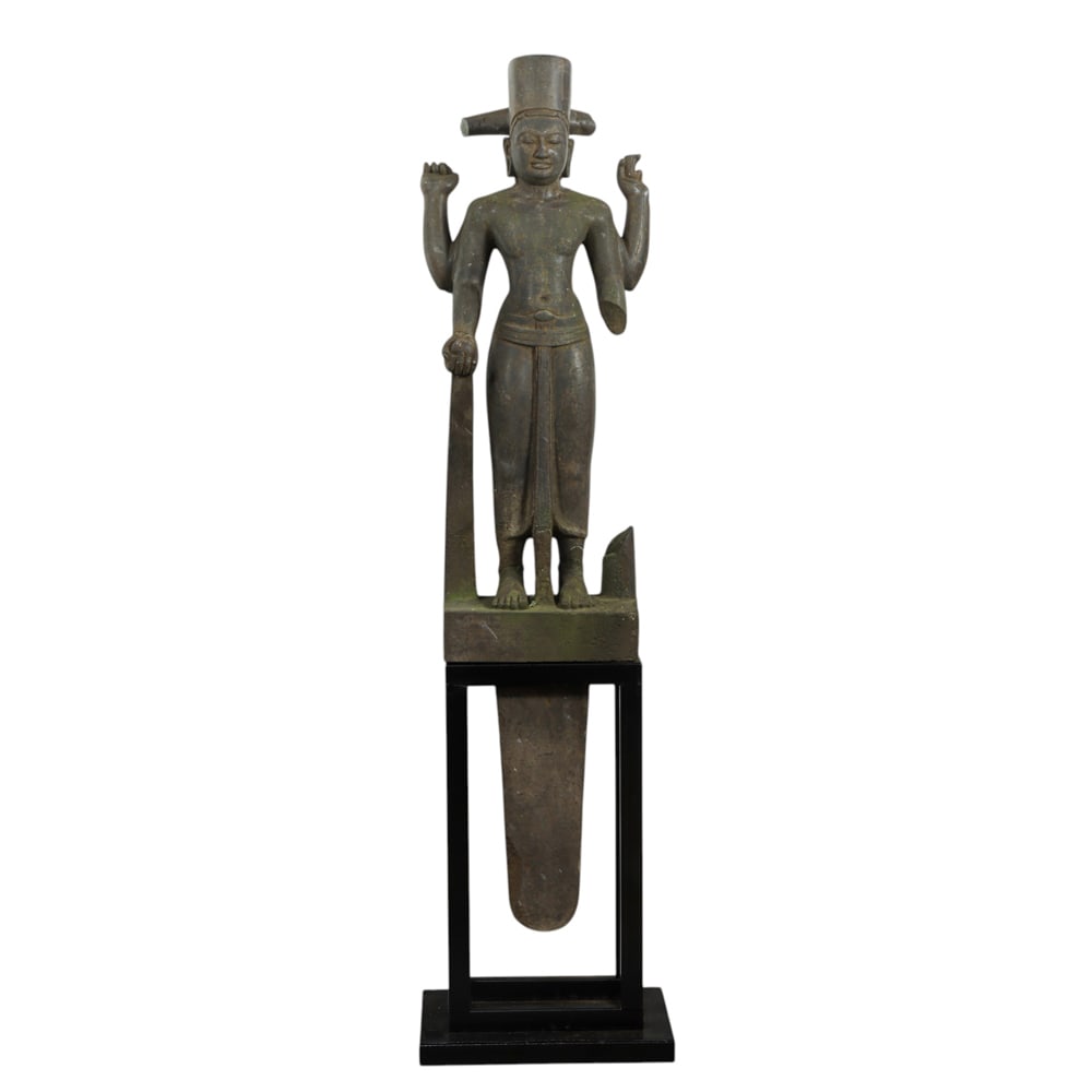 A Pre Angkor style stone Hindu figure on stand: A Pre Angkor style stone Hindu figure on stand. 66" high including stand. Provenance: purchased in Cambodia, July 2021