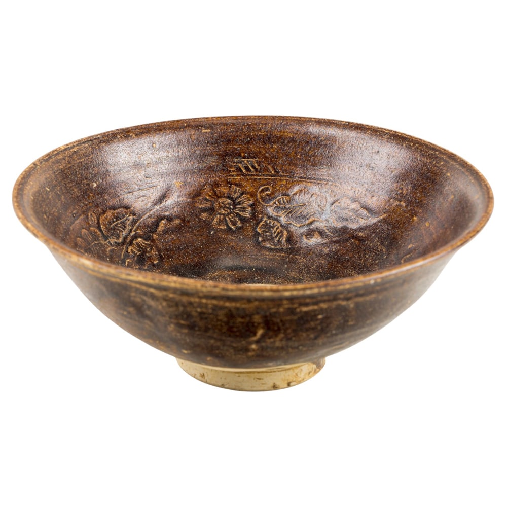 A Vietnamese brown glazed and molded pottery bowl (1 of 2)