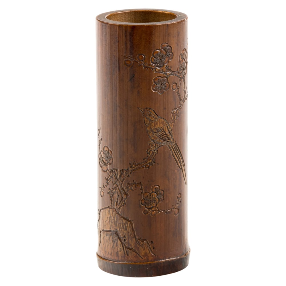 A Chinese carved bamboo brush pot: A Chinese carved bamboo brush pot. Depicting birds and flower motif, 4.75" high.