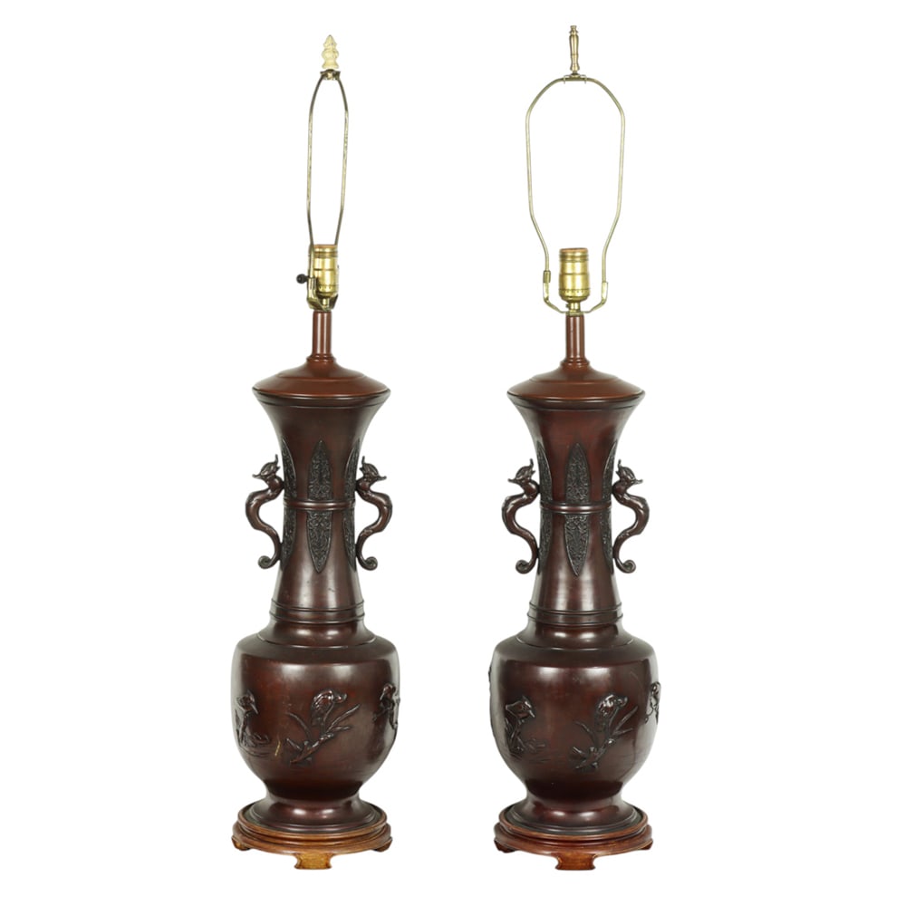 (lot of 2) Japanese bronze lamps: (lot of 2) Japanese bronze lamps. Featuring floral design, flanked by a pair of chilong handle, 35" high.