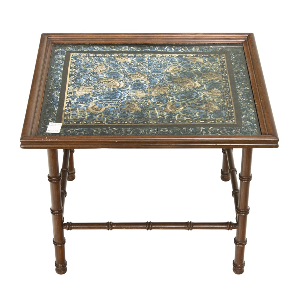 A Chinese tray table with an embroidery top: A Chinese tray table with an embroidery top. 20th century, 18.75"h x 24"w x 22"d.