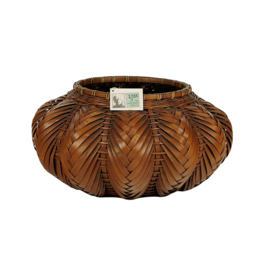 A Japaneses bamboo ikebana basket: A Japaneses bamboo ikebana basket. 6.5" high. Provenance: with a label from Sotheby's New York, The Andy Warhol Collection, lot 1705.