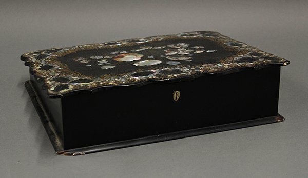 Victorian papier-mache and mother-of-pearl lap desk: Victorian papier mache and mother of pearl lap desk, the hinged lid centering a floral spray flanked with painted and mother of pearl inlaid border, opens to reveal the original red velvet writing sur
