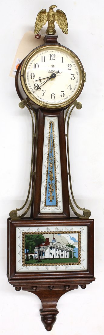 Federal style banjo clock: Federal style banjo clock, the finial capped case with a paper dial marked Telechron, the shaped case with two eglomise decorated panels and terminating on a drop finial, 32"h