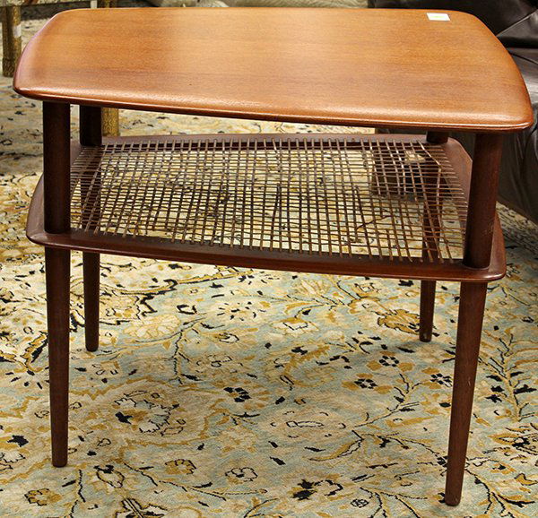 Danish modern teak two-tier side table: Danish Modern tiered occasional table, having a tapered square top rising on tapered legs conjoined by the rattan wrapped lower tier; 22.5"h 26"w x 26'd.