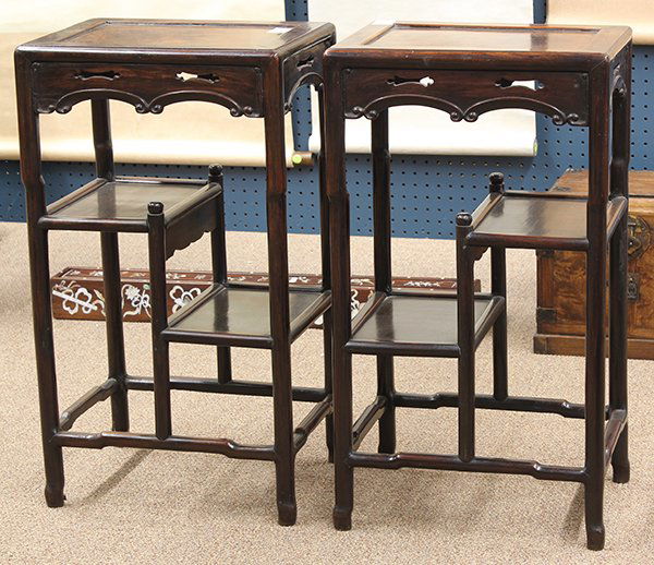 Chinese Wood Tiered Stands: (lot of 2) Chinese rosewood tiered stands, late Qing/Republic period, set with a floating panel to the top, the apron with shaped cutouts above a scroll edge, the humpback supports further joined to t