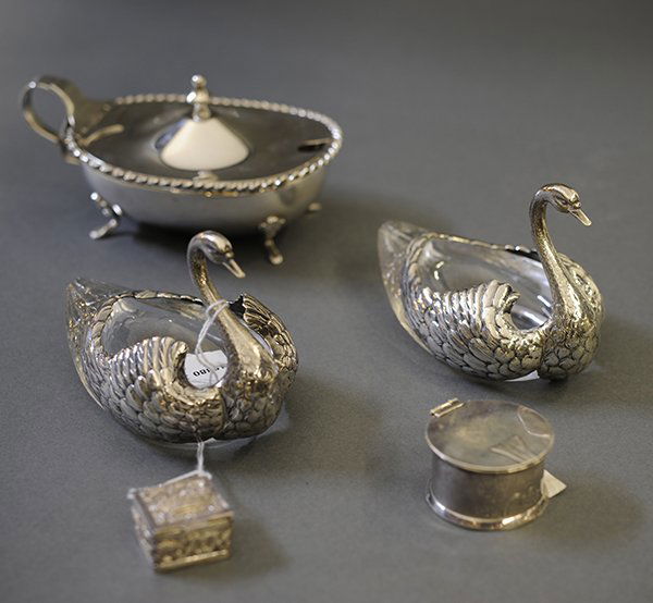 Silver table articles: (lot of 5) Silver table articles including a pair of swans, stamp box, pill box, pair of Bigelow & Kennard sterling mounted swans, and an .800 silver sauce boat, 9.63 troy oz.