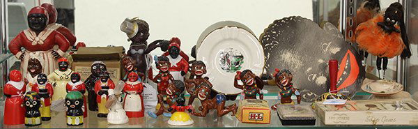 One shelf of Black Americana: One shelf of Black Americana including plastic and ceramic salt and pepper shakers, figurines, etc. Mostly vintage