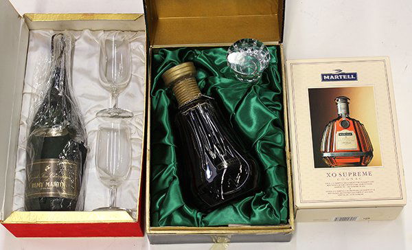 Bottles of cognac: (lot of 3) Bottles of cognac consisting of Martell XO Supreme, Napoleon, and Remy Martin
