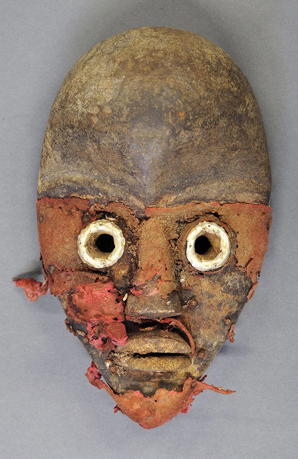 Dan Complex, Liberia traditional "runners mask" post: Dan Complex, Liberia traditional "runners mask" post 1960, having trade cloth or military uniform remnants, and aluminum eyes