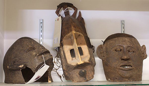Dogon and Makonde, Africa masks: (lot of 3) African masks consisting of a Dogon, Mali, Kanaga wood mask having pigment decoration and fiber accents; together with a Makonde, Tanzania or Mozambique helmet mask and a clay mask Provenan
