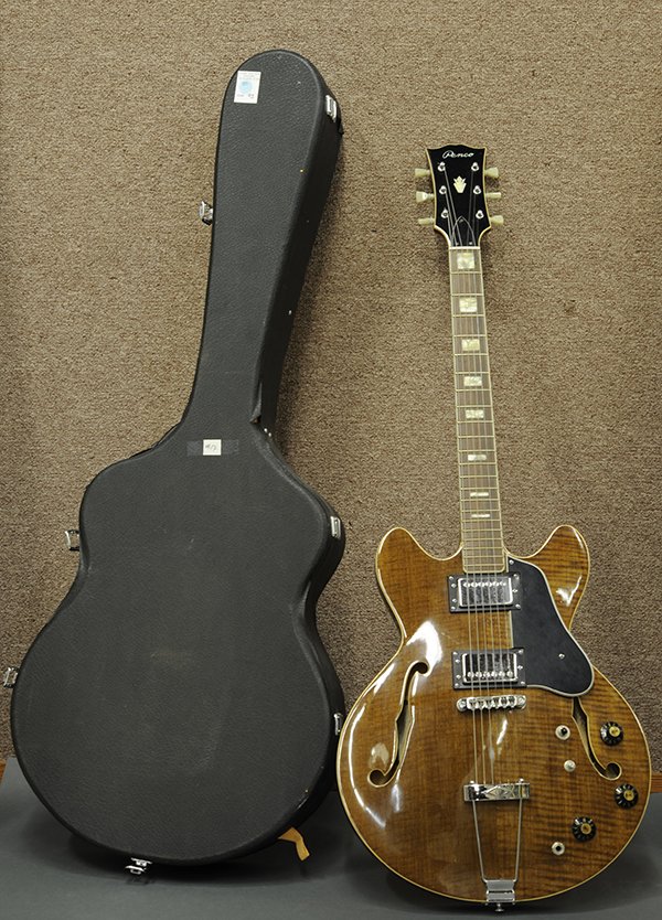 Mid-century semi-hollow electric guitar: Mid-century semi-hollow electric guitar, having two pick ups and mother of pearl inlay, marked Japan to back to neck and Remco to front, retaining hard case42"l.