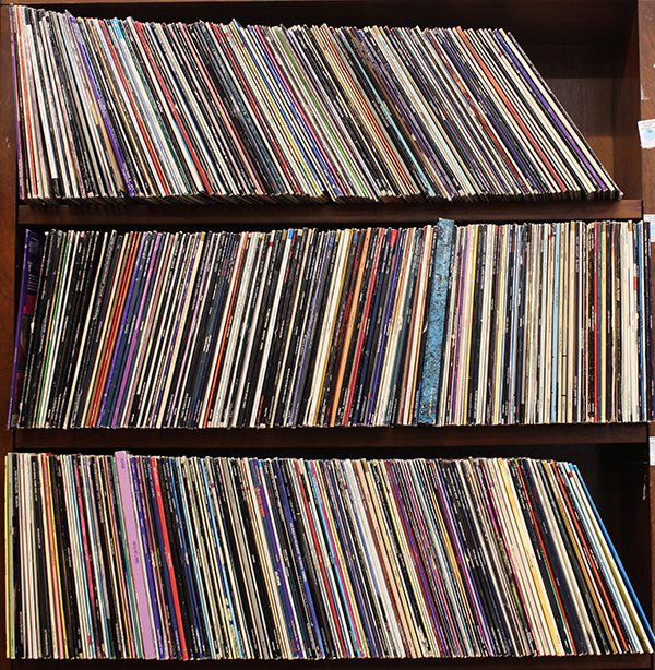 Three shelves of laser discs: Three shelves of laser discs including classic films such as 50th Anniversary of Gone with the Wind, cartoons, contemporary movies, etc.