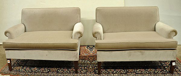 Pair of diminutive settees in the mid century taste: Pair of diminutive settees in the mid century taste, the tailored pieces have tight backs and single cushions with rolled arms rising on dark wood legs, and are upholstered in grey velvet, 29"h x 41"w